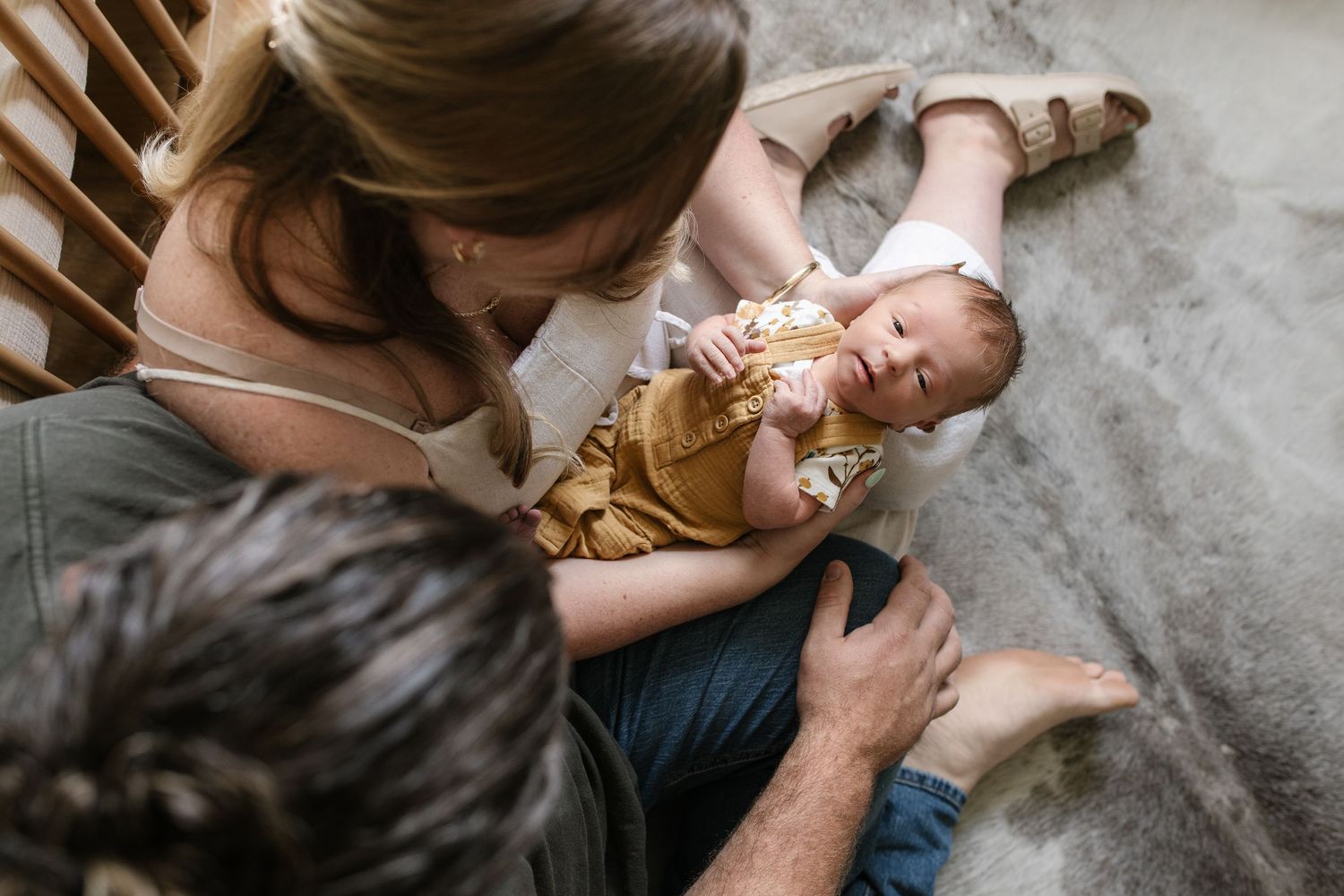 Lifestyle photographs capturing intimate feeding moments between parent and baby.