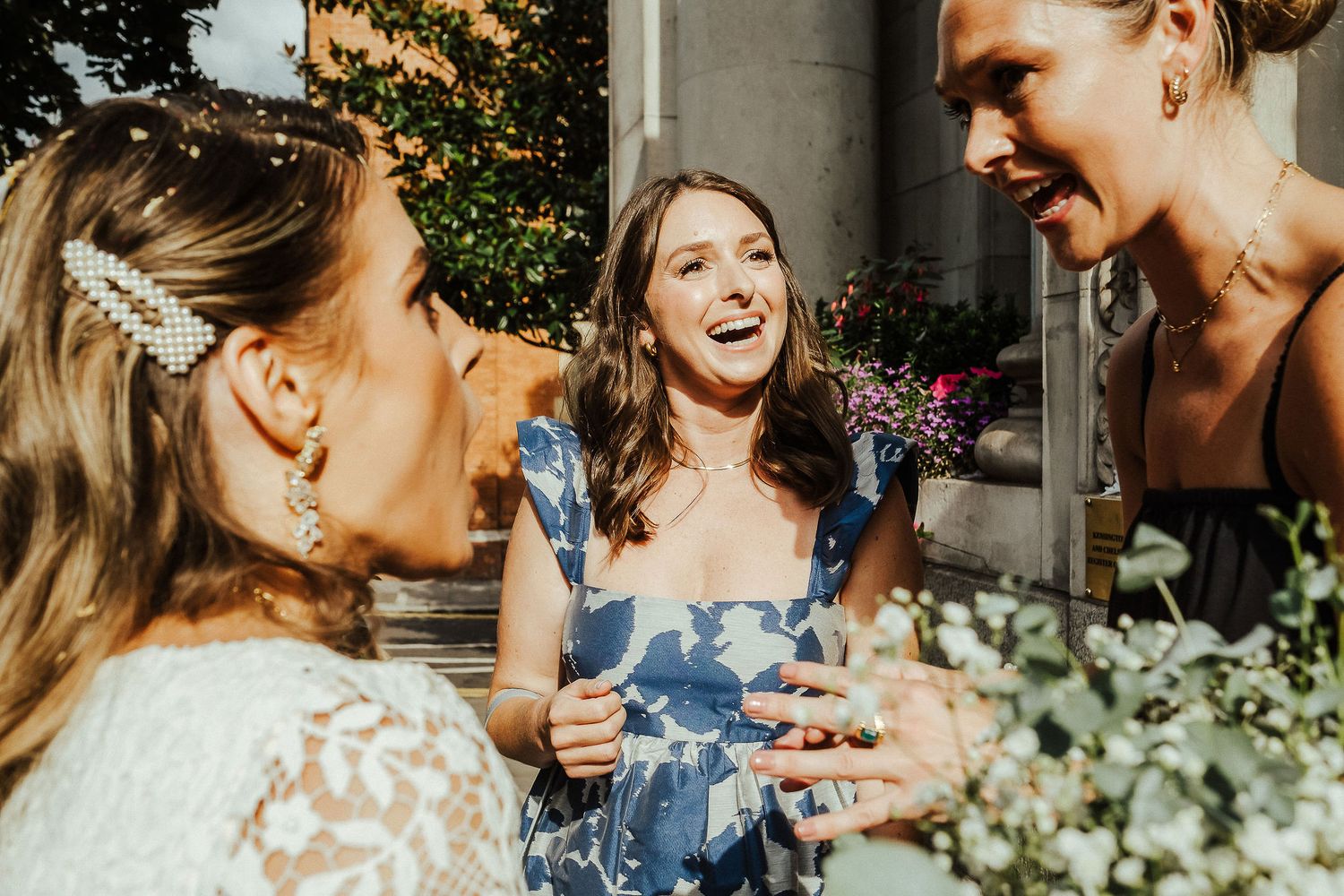 A series of candid wedding photos showing joyful moments between a couple and wedding party in an outdoor setting.