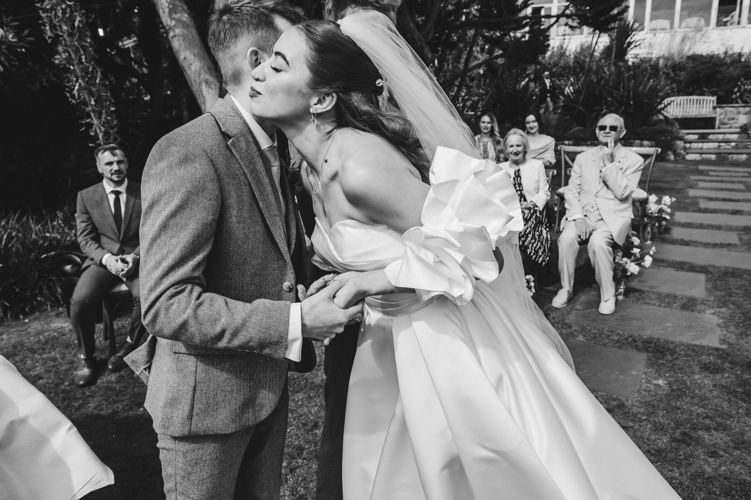 A black and white photo sequence shows a couple dancing outdoors in a romantic embrace.