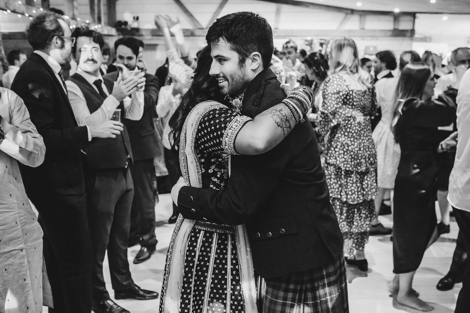 Couple sharing an intimate dance moment at a Scottish-Indian fusion wedding.
