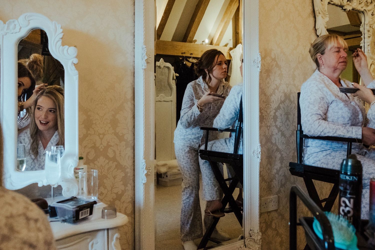 Wedding preparation scene showing mirrors and getting ready activities in an ornate room.