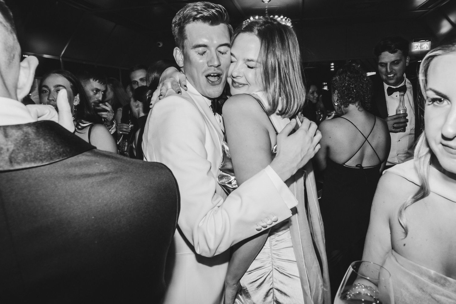 Black and white photos show couples slow dancing closely together at what appears to be a vintage dance or party.