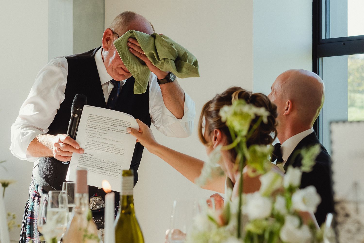 A group of people toasting with champagne glasses at an elegant celebration event.