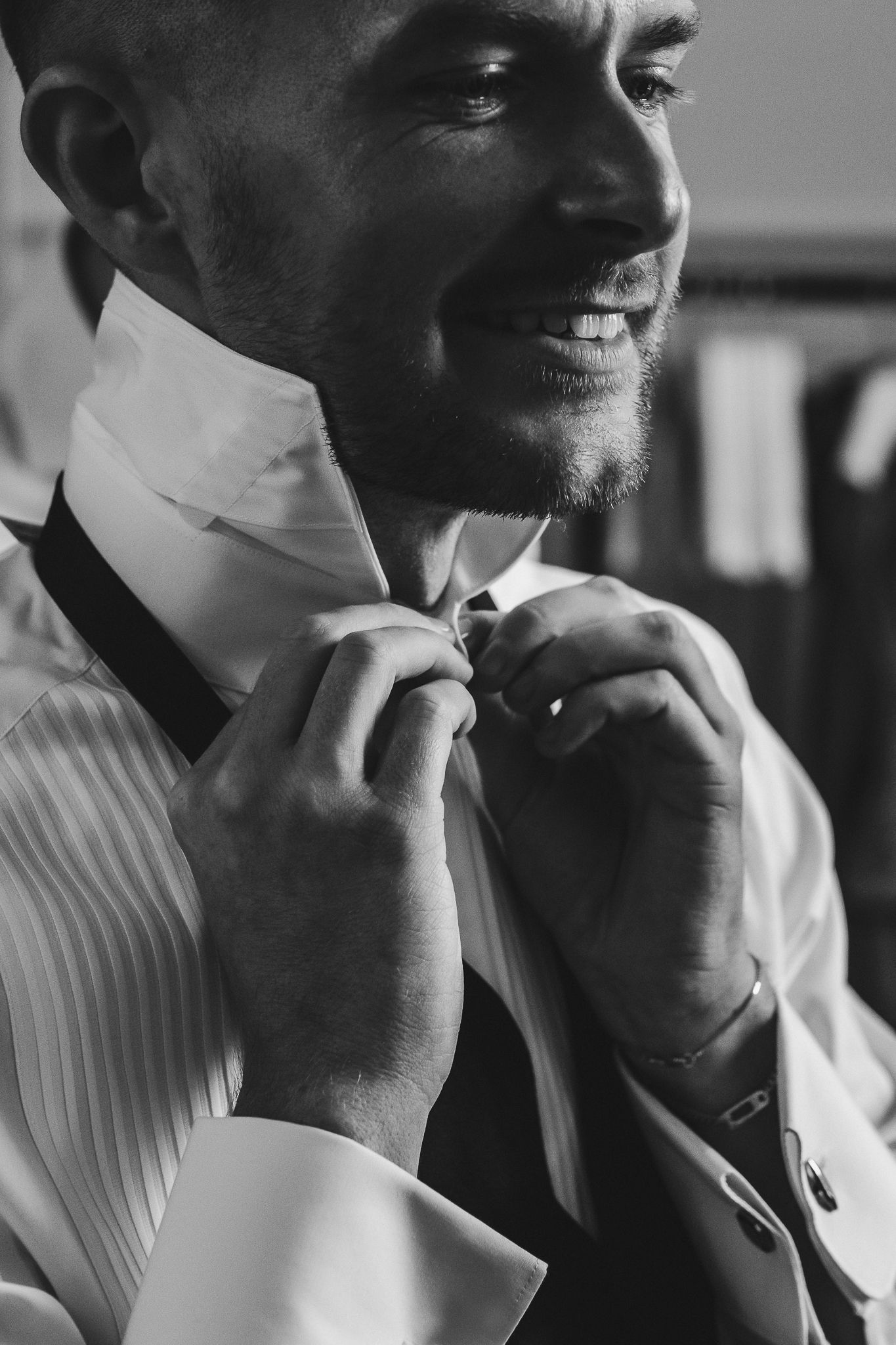 Black and white portrait sequence showing a person's contemplative expressions in a white collared shirt.