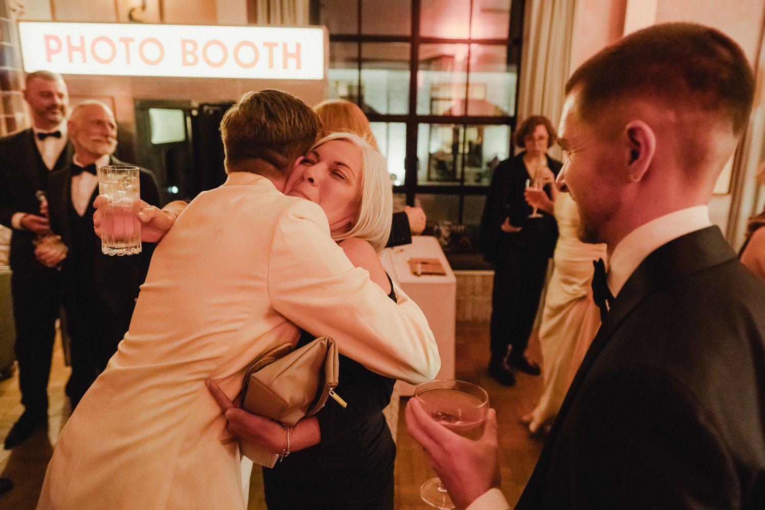 A collection of photo booth strips showing wedding guests posing and having fun at a reception celebration.