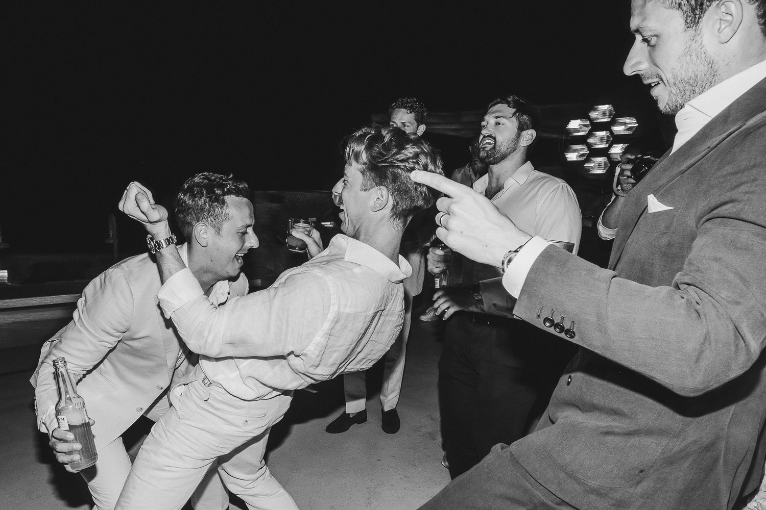 A series of black and white photos showing people engaged in a street fight or brawl.