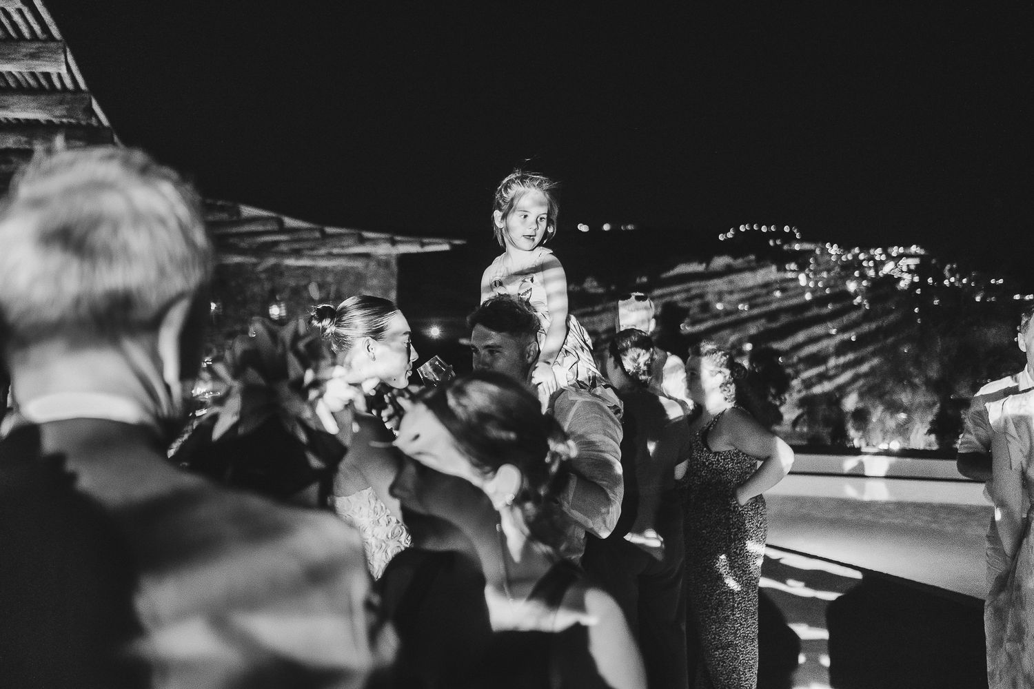 Musicians playing trumpets in a series of black and white performance photographs.