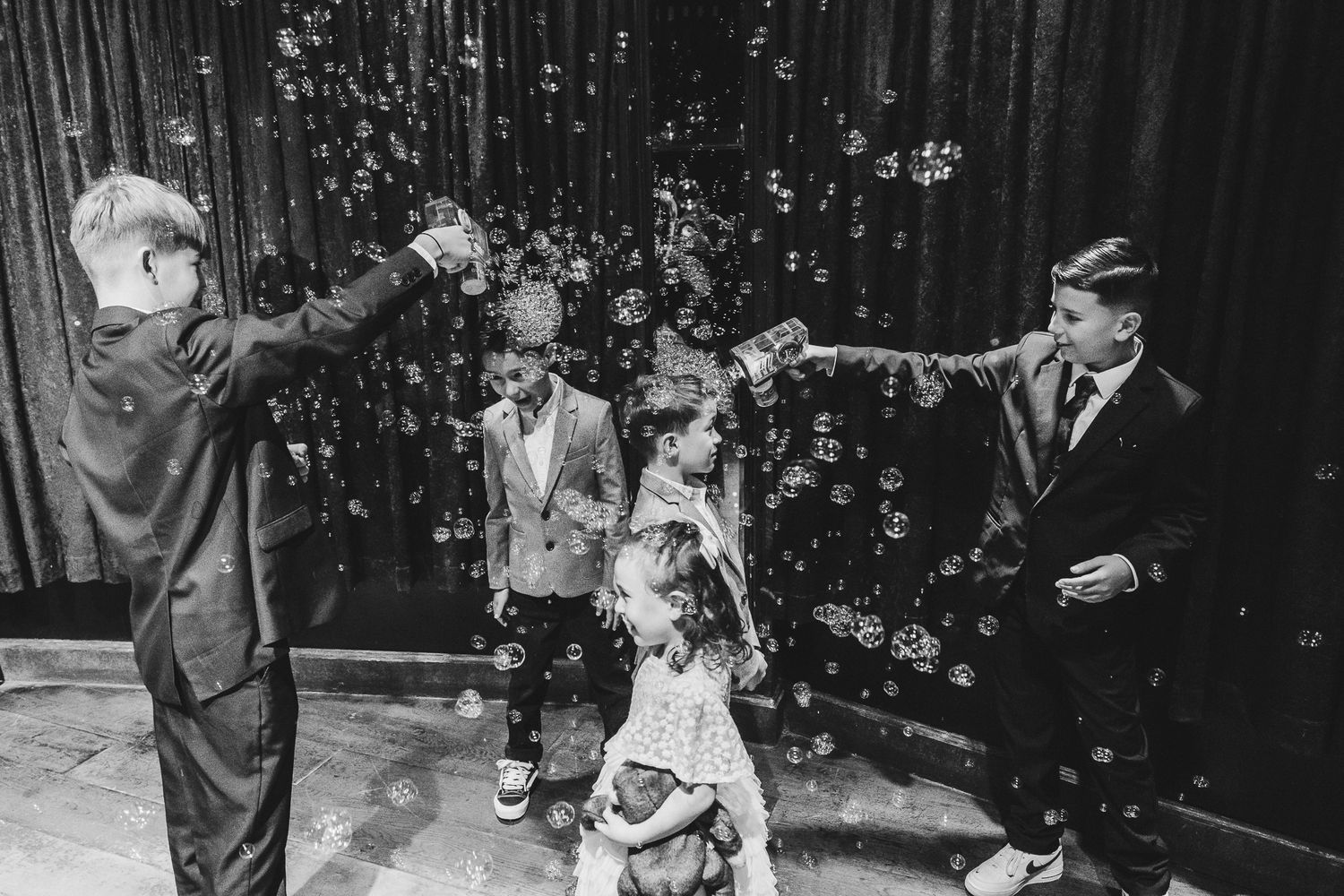 A series of vintage black and white photographs showing people dancing at what appears to be a wedding celebration.