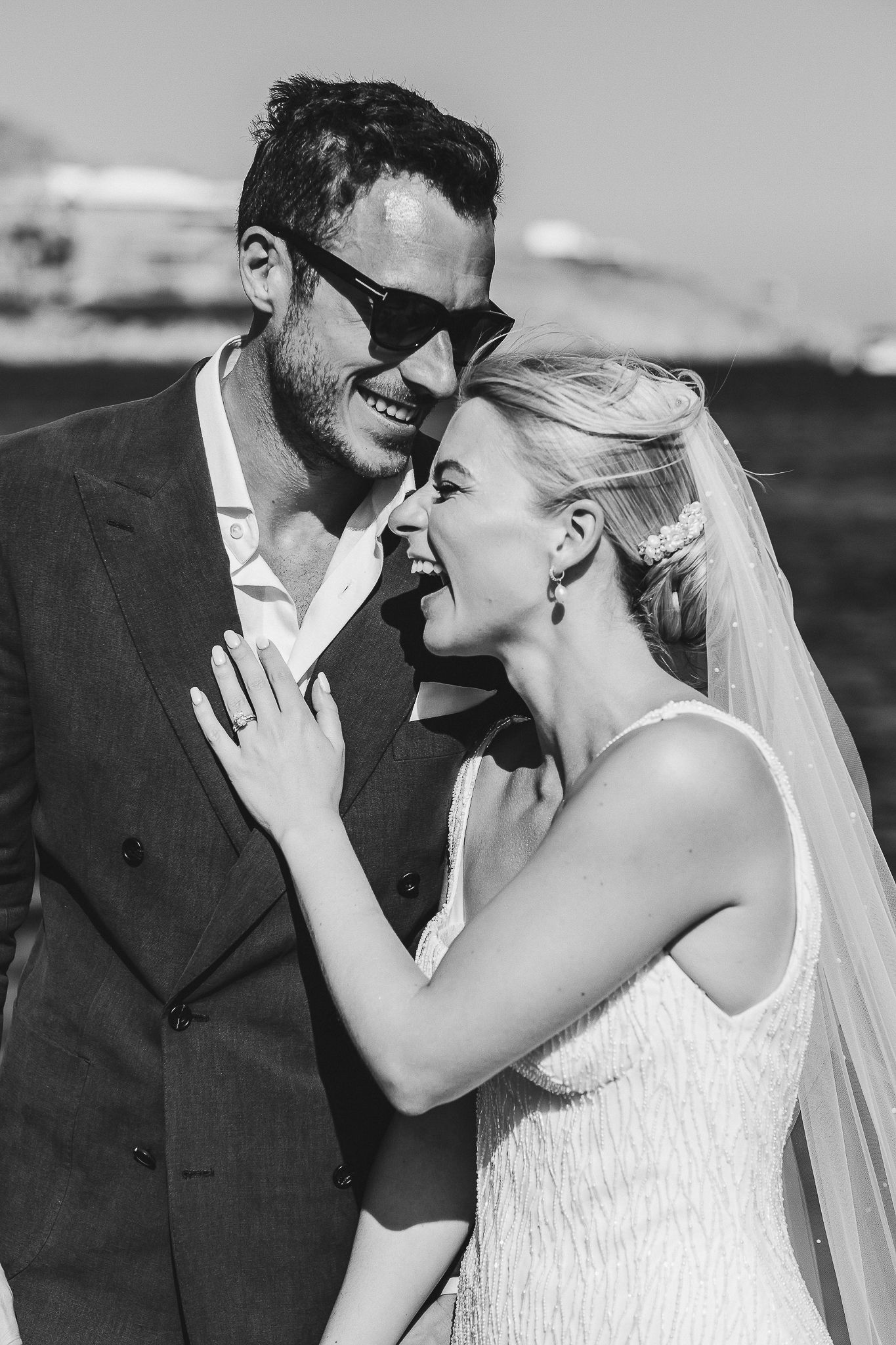 Black and white wedding photo series showing romantic sequence of intimate kisses between newlyweds.