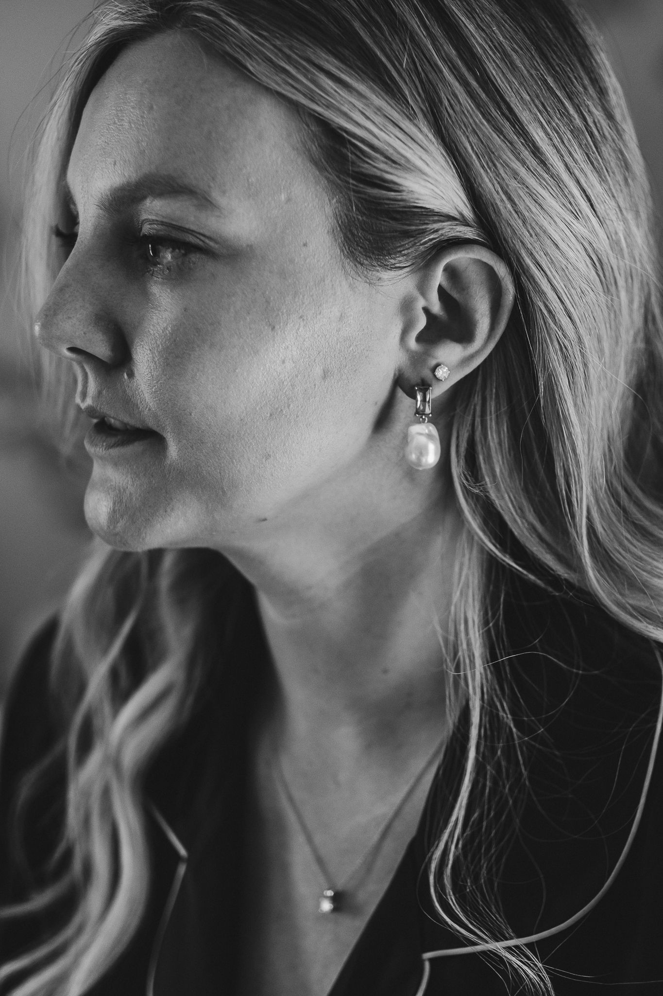 Black and white profile portraits showing elegant pearl earrings and delicate jewelry styling.