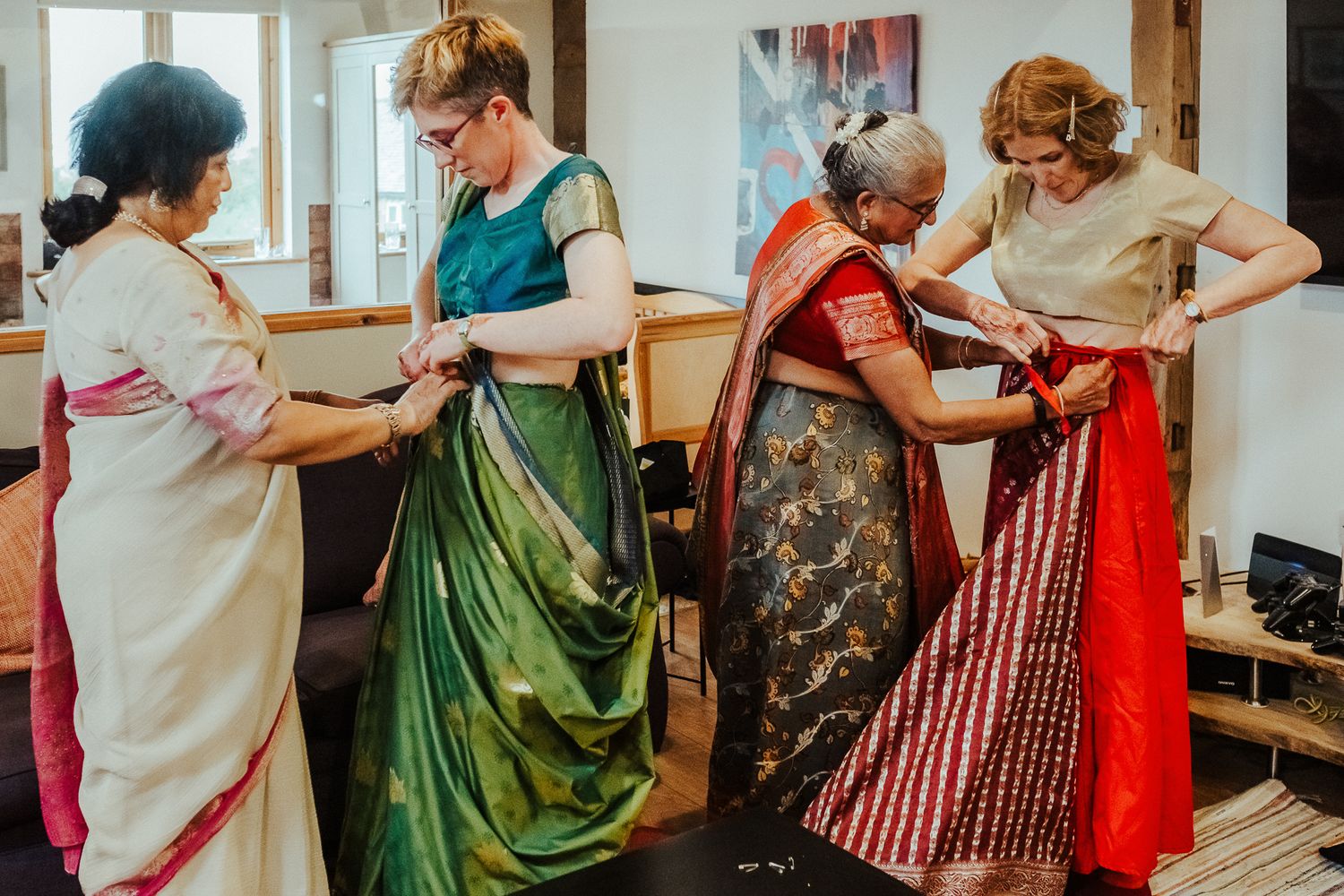Colorful traditional dance scene with people in vibrant dresses moving together.