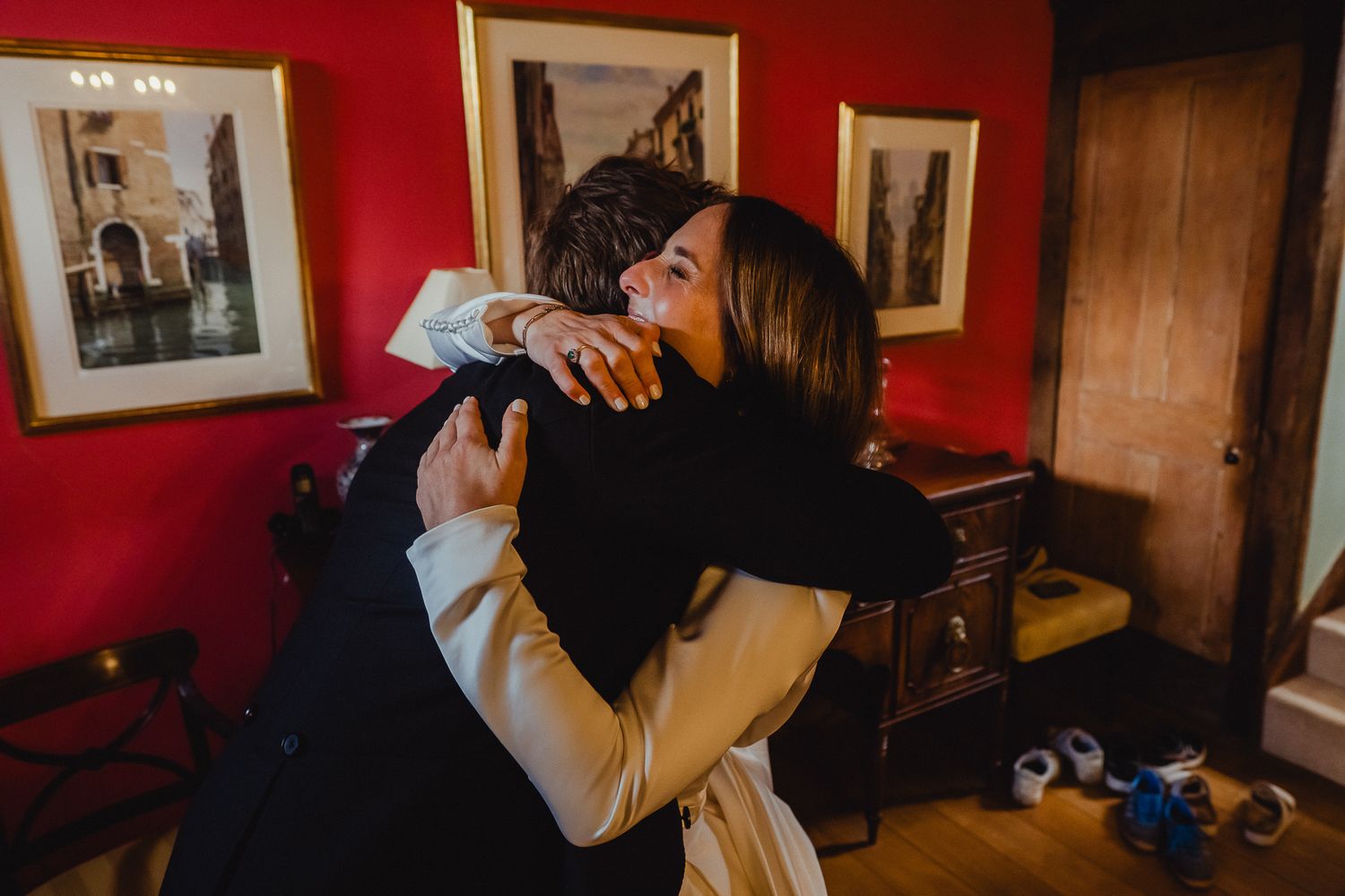 Several photographs show intimate moments in a room with red walls and wooden paneling.