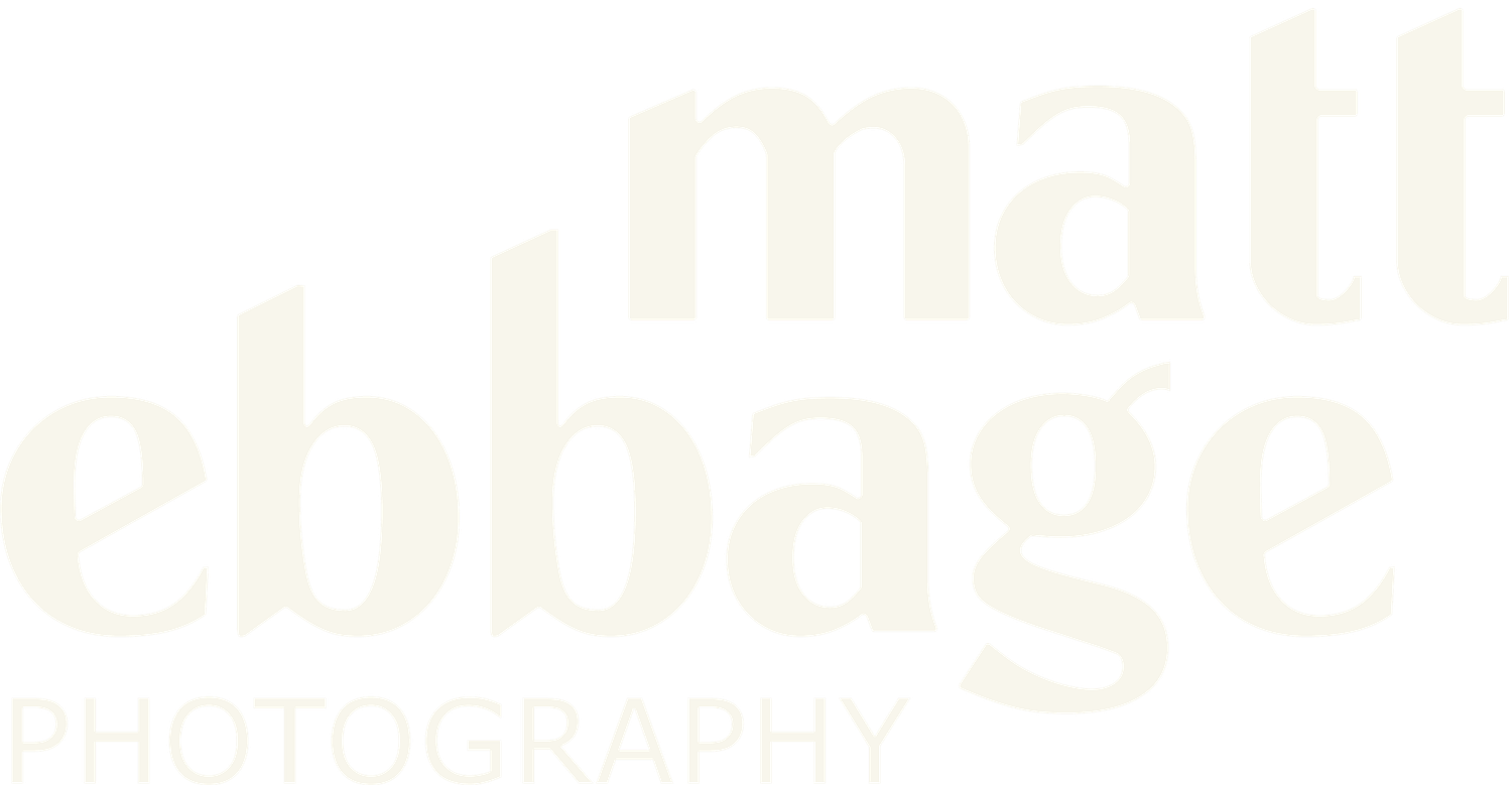 Faded beige text appears blurry against a white background.
