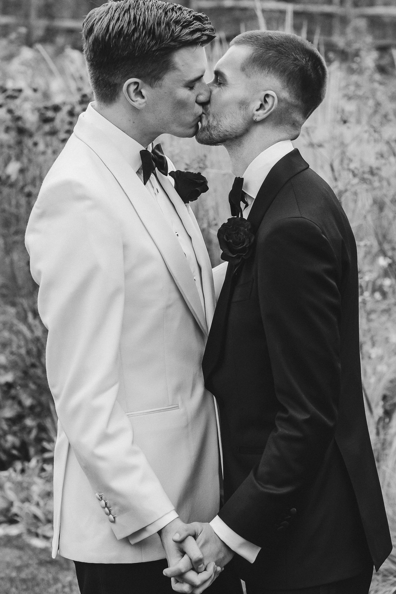 A romantic black and white photo series showing a couple in contrasting white and black formal attire sharing tender moments.