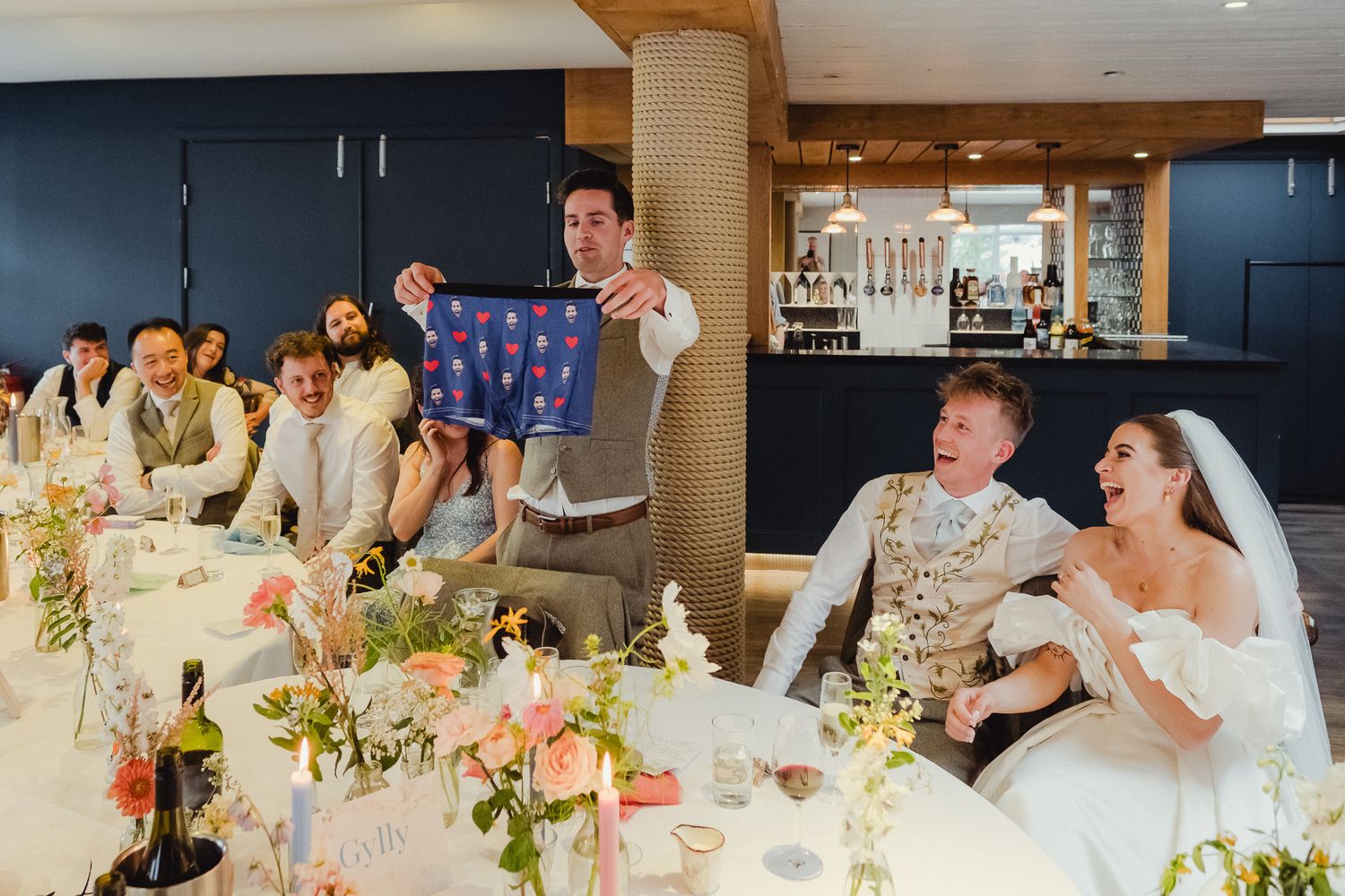 A collection of wedding reception photos showing guests dining and celebrating at decorated tables.