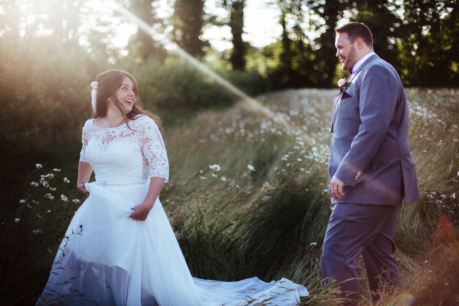 Romantic sunset portrait session in a golden field with soft natural lighting.