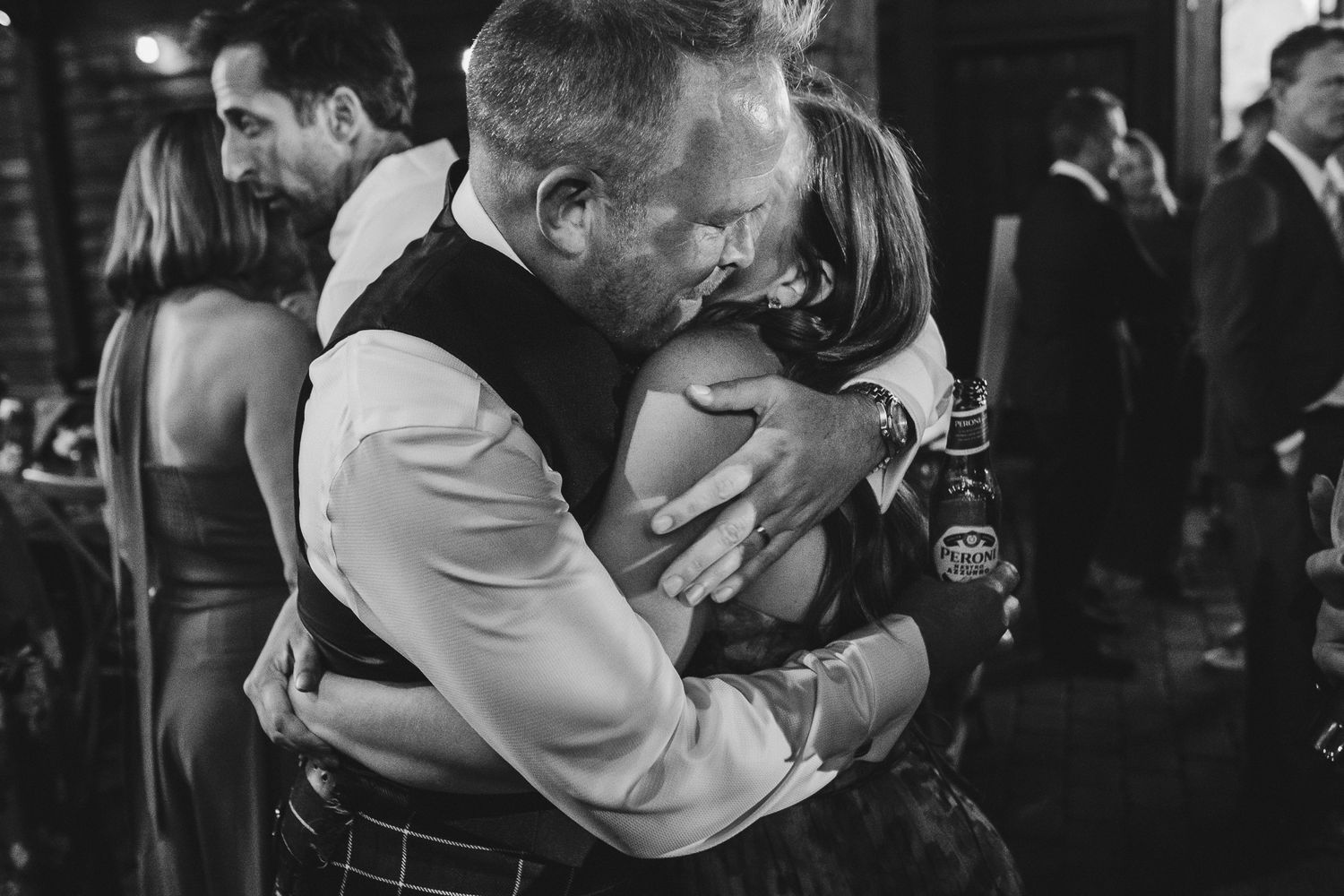 A series of black and white photographs showing couples dancing together in a romantic embrace.