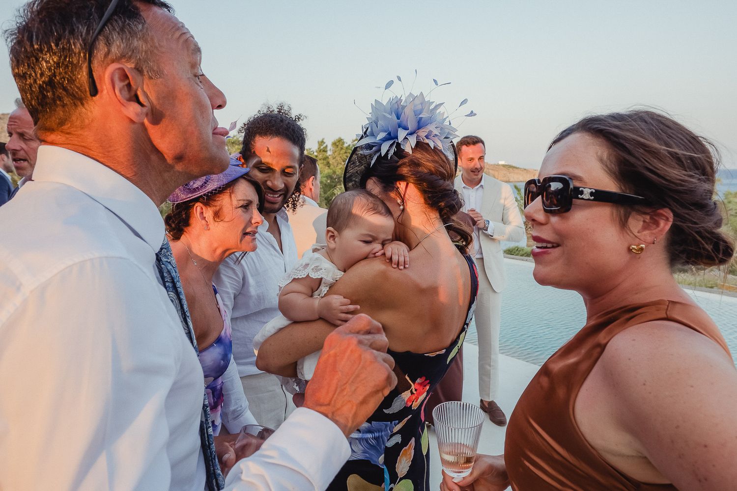 A montage of wedding photos showing couples sharing romantic kisses in various outdoor settings during sunset.