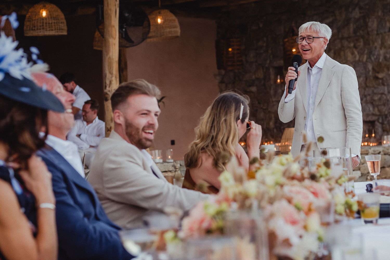 A series of candid reception moments show guests seated at tables during an elegant wedding celebration.