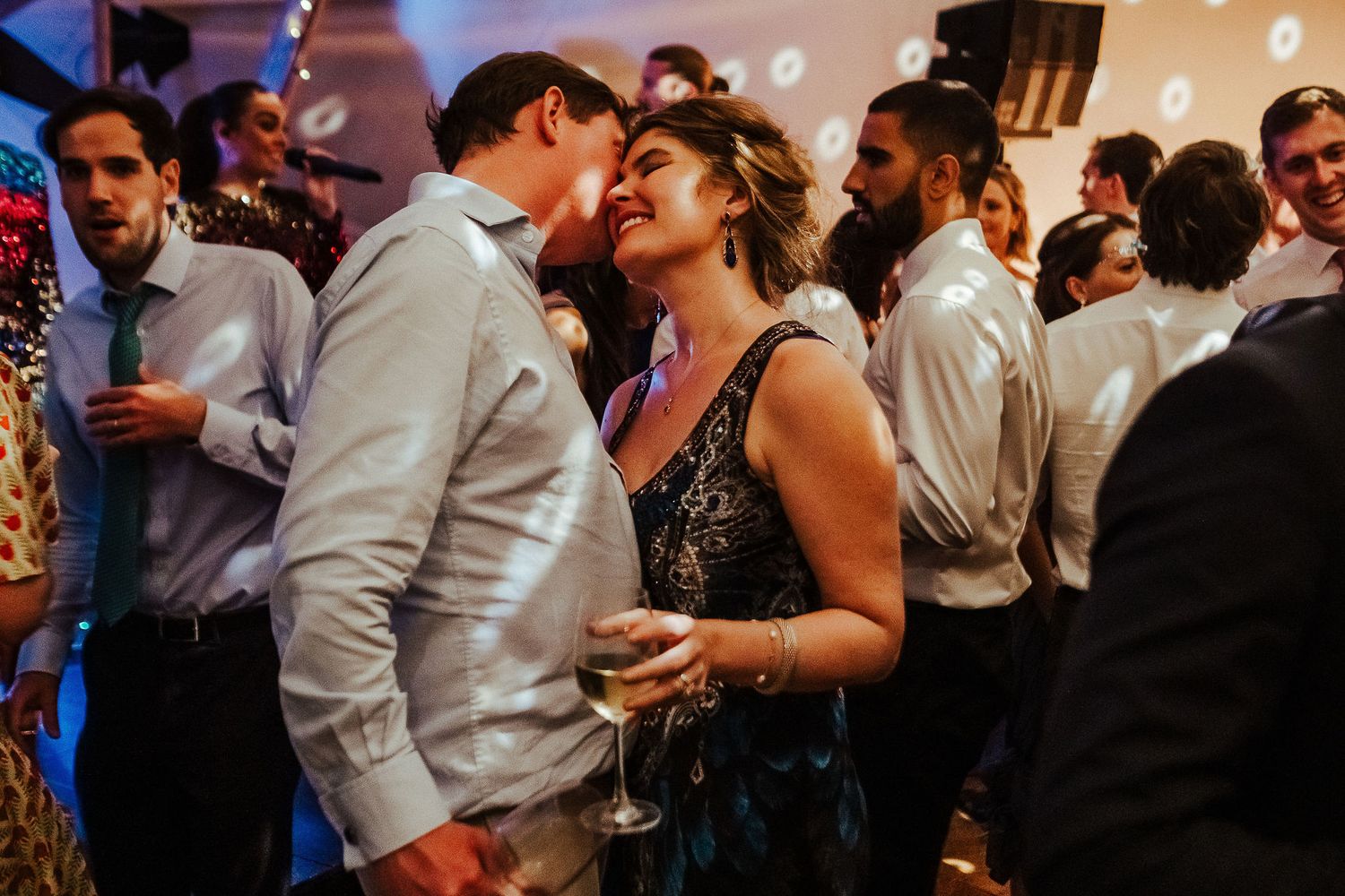 Couple sharing an intimate moment while dancing at their wedding reception.