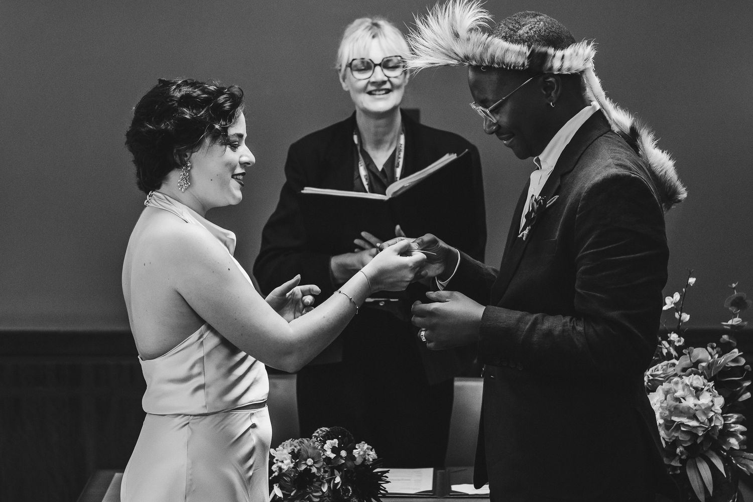 Black and white wedding ceremony photos showing emotional moments between couples during their special day.