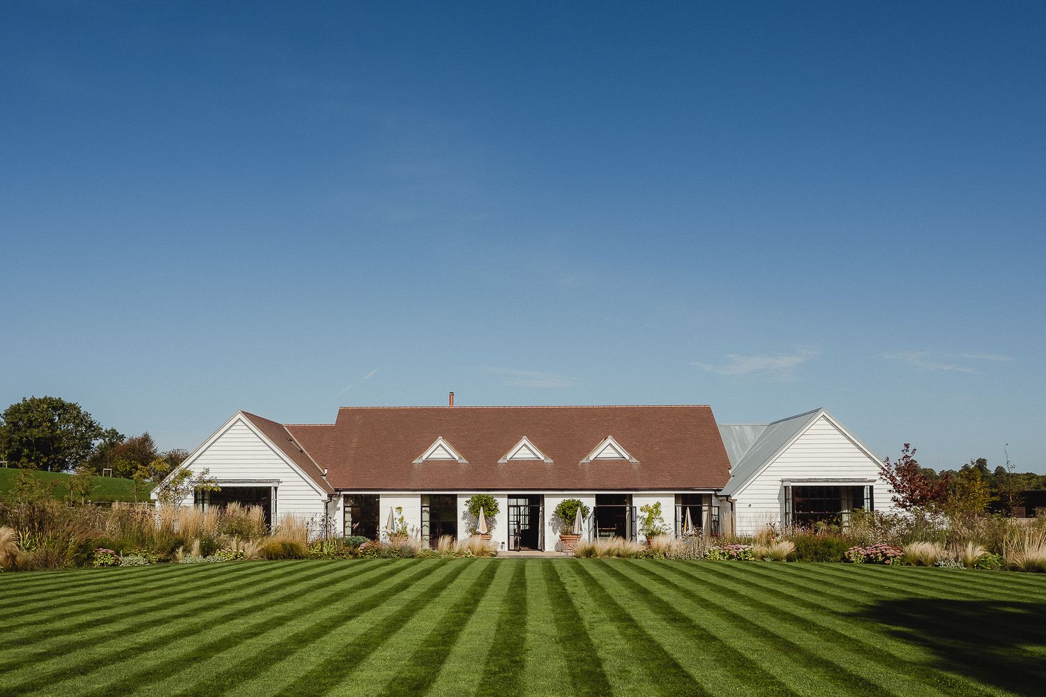 LIMEKILN Wedding Photography - The beautiful LIMEKILN in Sussex set against a clear blue sky