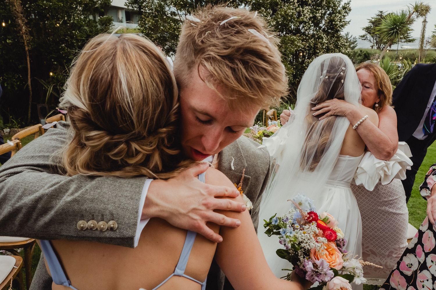 A series of intimate wedding photos showing tender moments between couples during their outdoor celebrations.