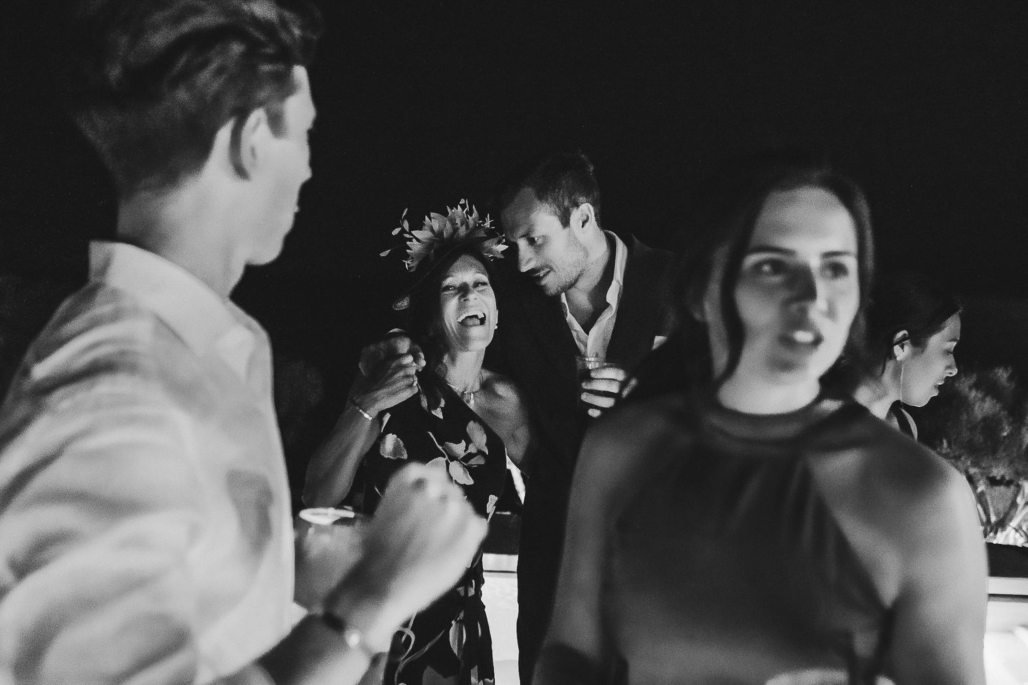 A series of black and white photos showing people dancing at what appears to be a wedding reception or party.