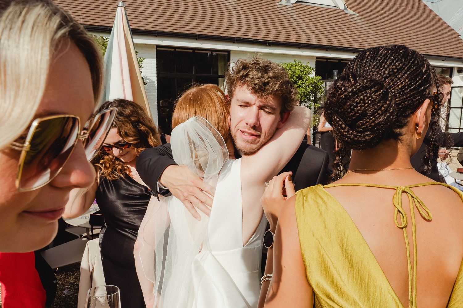Guests mingle and socialize during a festive outdoor wedding celebration.