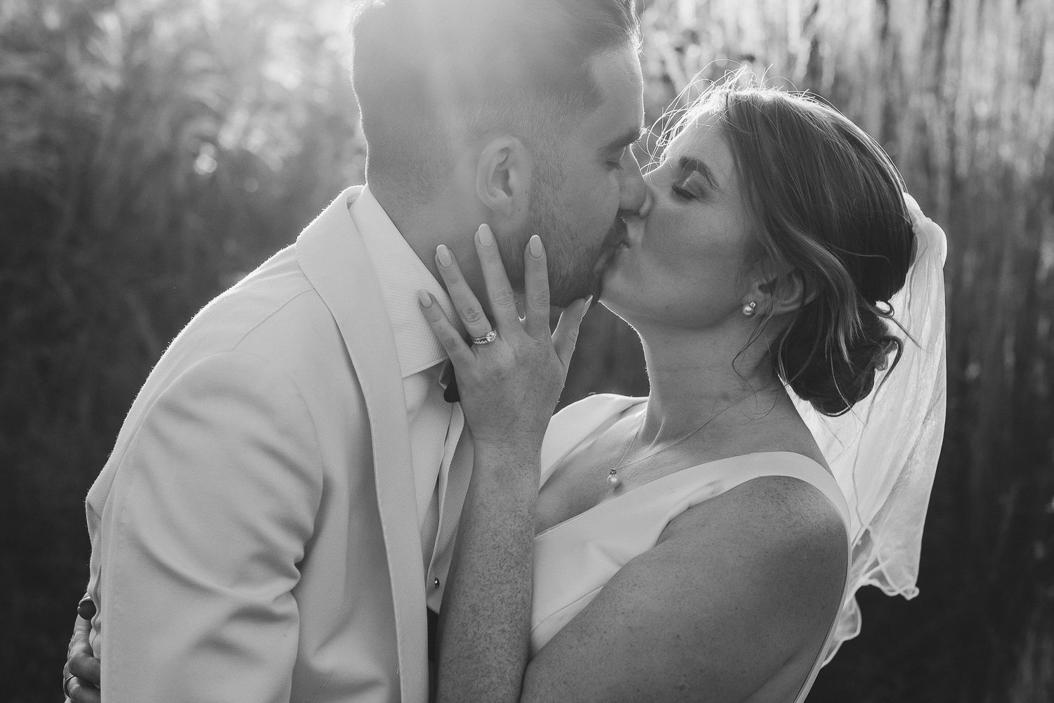 Black and white wedding photography at LIMEKILN - romantic wedding photo showing intimate moment between newlyweds during their celebration