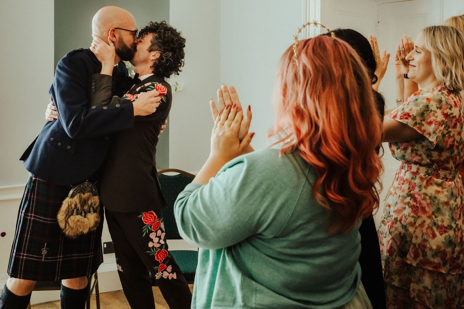 A series of candid photos showing people dancing and embracing at what appears to be a social gathering or party.