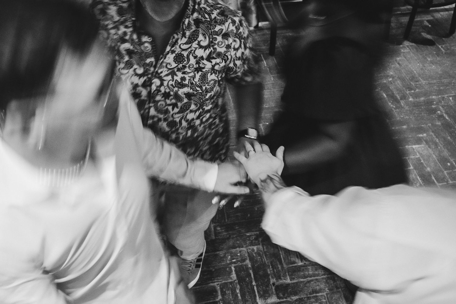 Black and white photos show hands playing a piano keyboard in an expressive performance sequence.