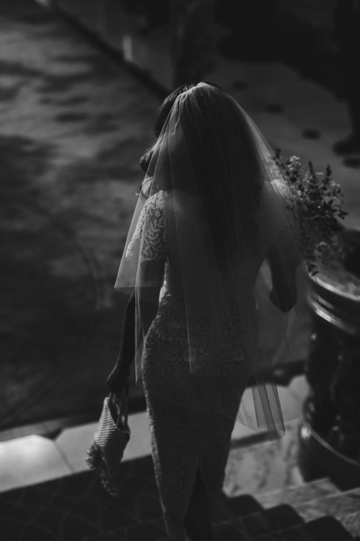 A black and white sequence of images showing a person walking away in a dark, moody setting.