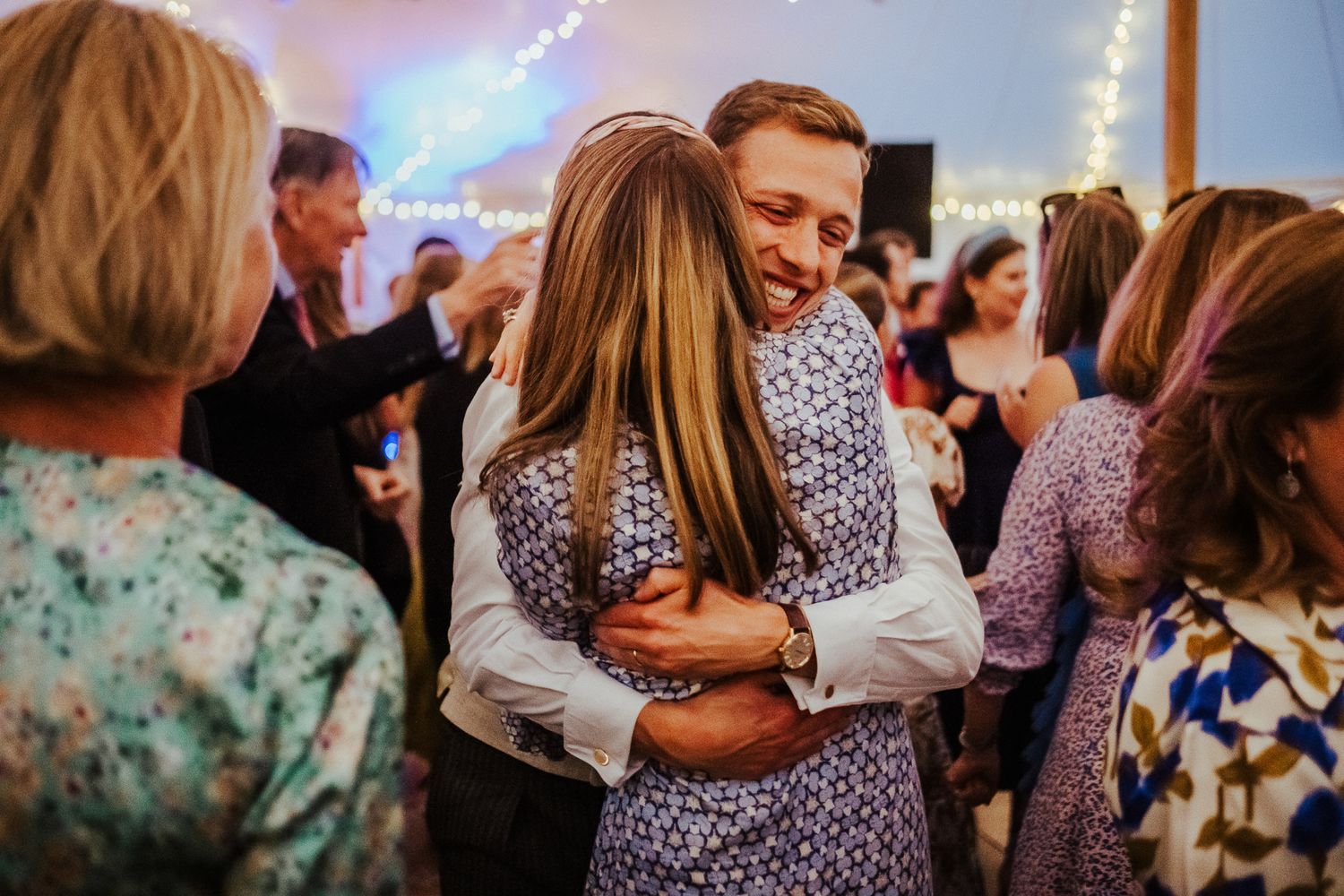 Intimate dance floor moment during wedding reception celebrations.