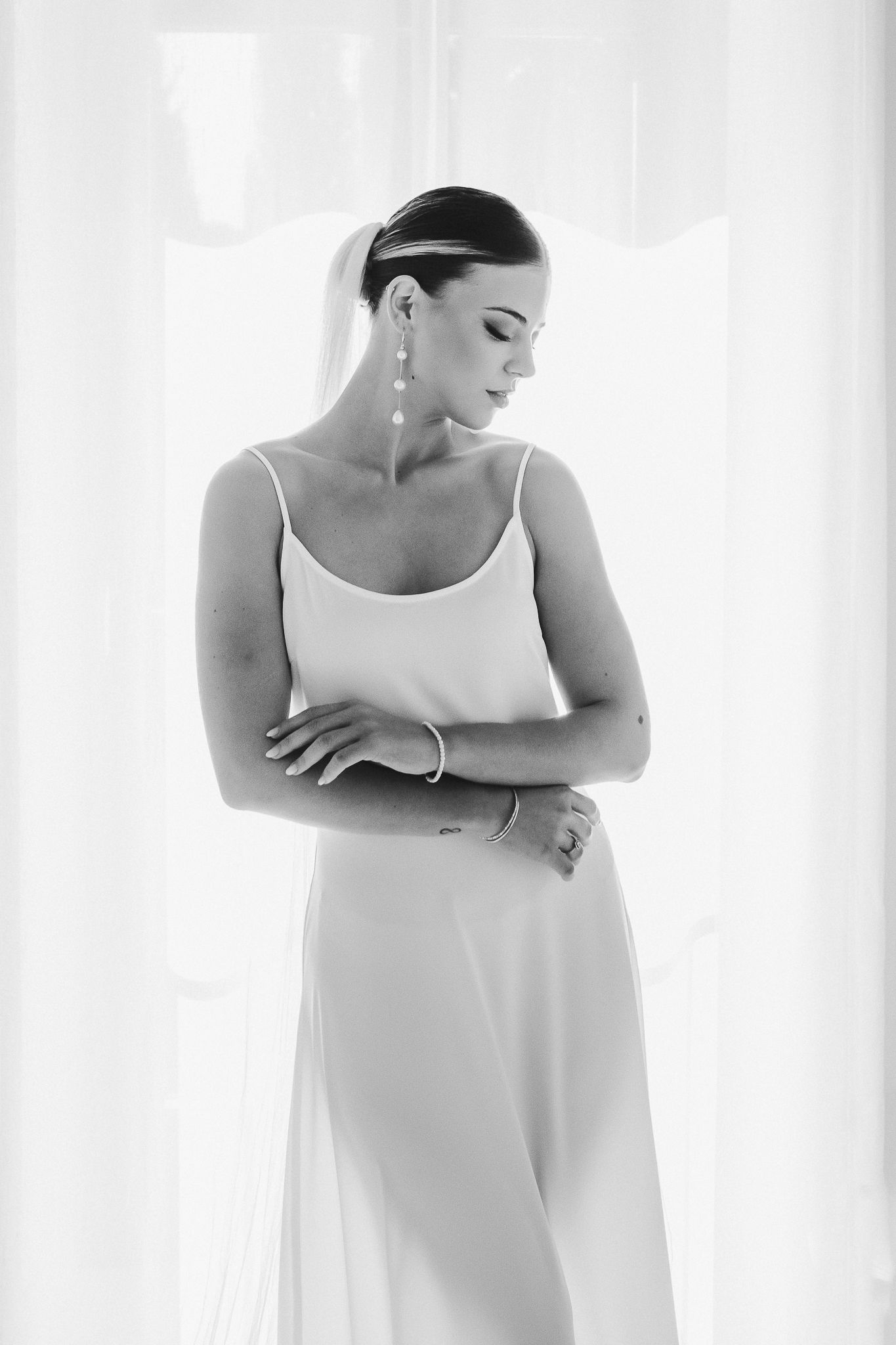 Series of minimalist bridal portraits showing graceful poses in white dress against bright background.