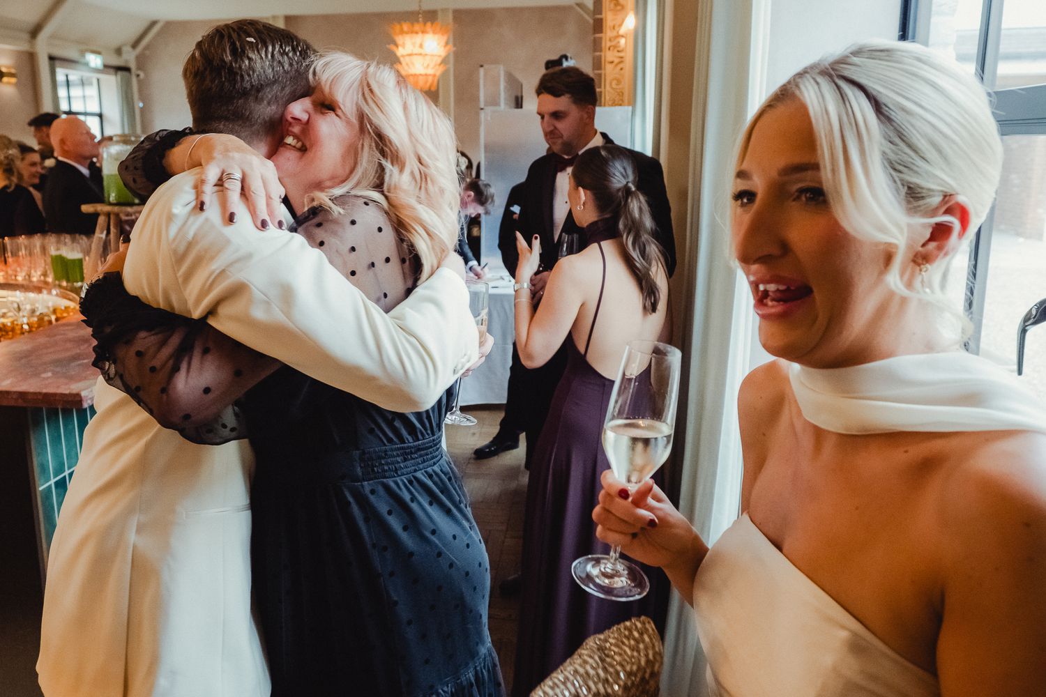 Romantic moments captured in a series of wedding photos showing tender kisses and embraces in an elegant indoor setting.