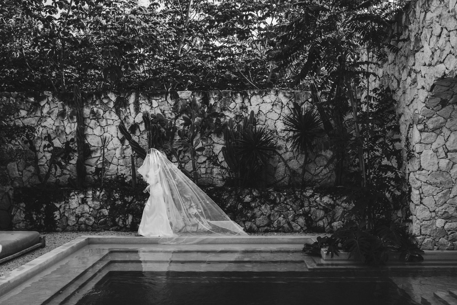 A series of black and white wedding photos arranged in a horizontal collage showing outdoor garden ceremony scenes.