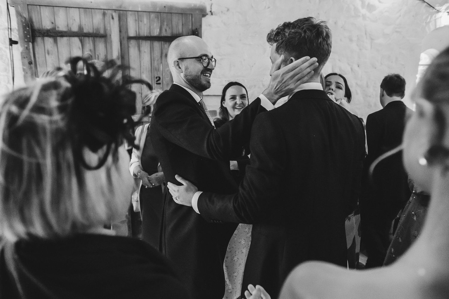 Two dancers performing a passionate Latin dance routine in formal attire at a dance studio or ballroom event.