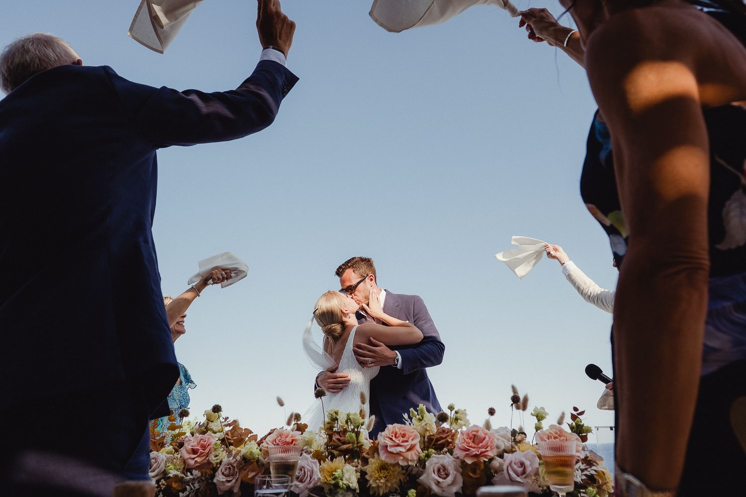 Couple enter their dinner to napkins being waved at Soho Roc House in Mykonos