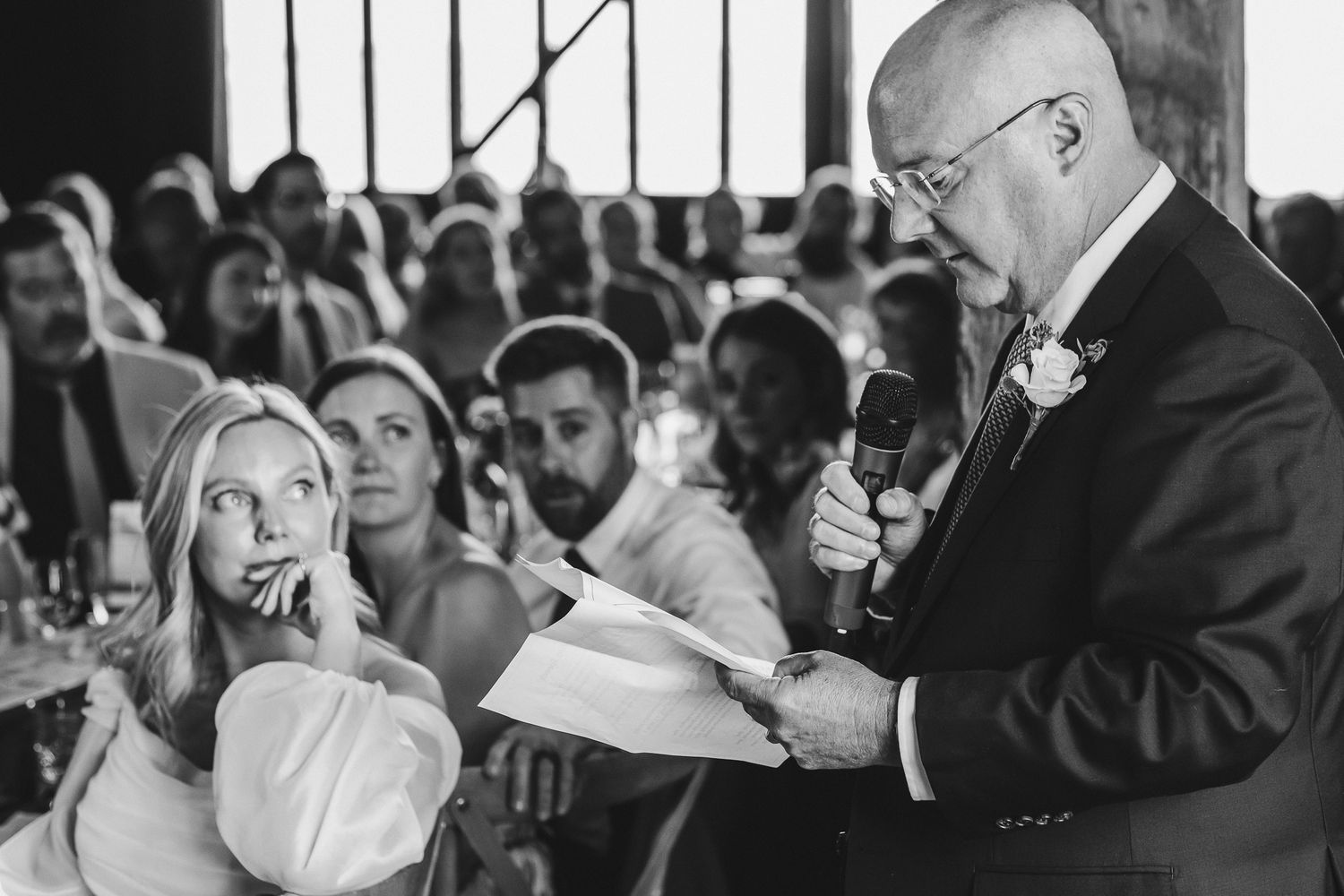 A collection of black and white wedding photographs showing candid moments during a celebration.