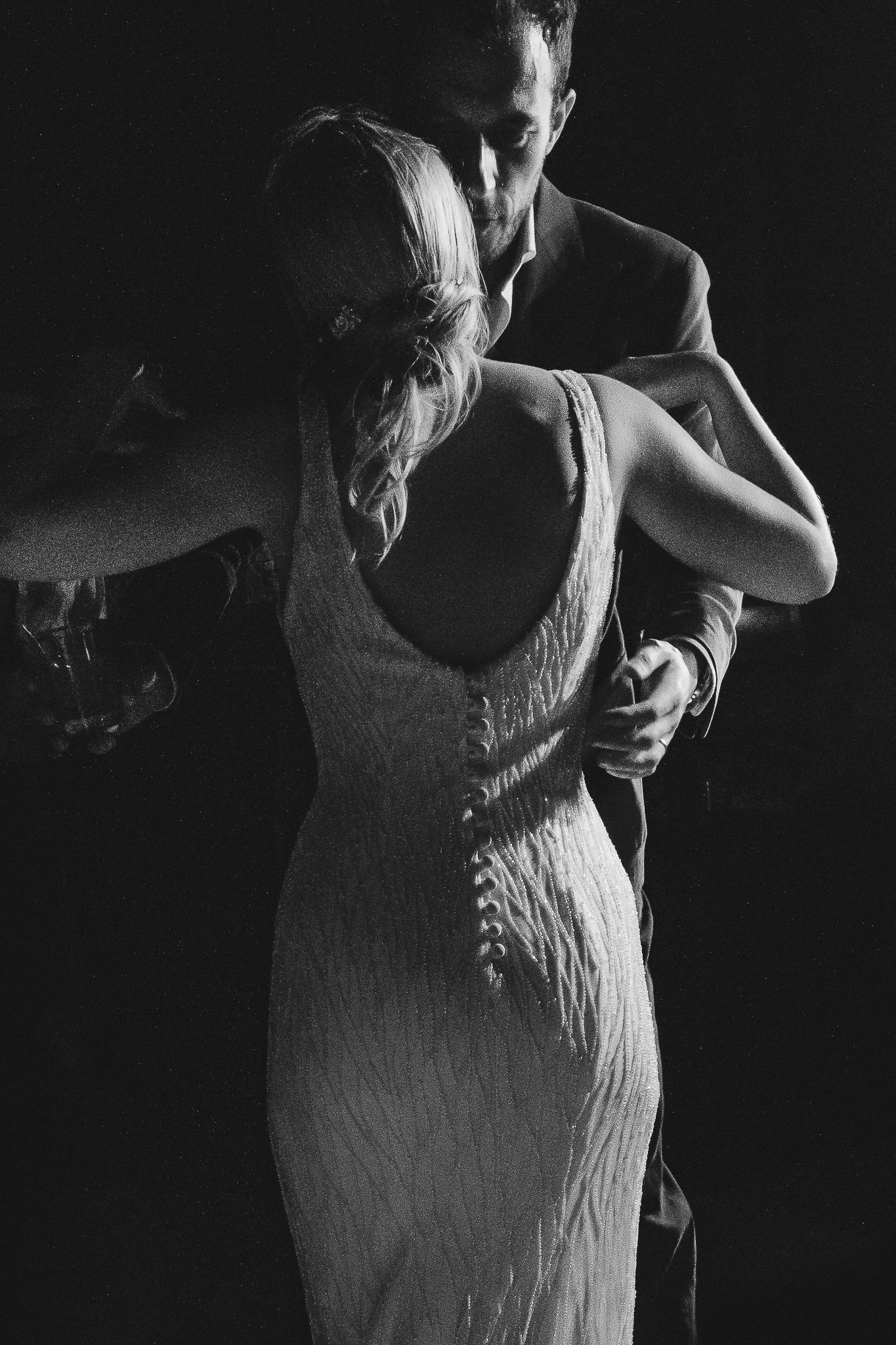 A dramatic black and white series showing two dancers performing an intimate partner dance sequence.