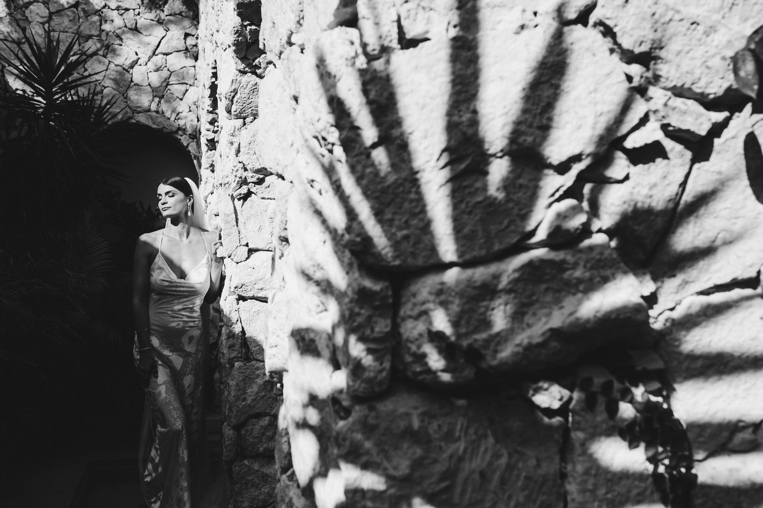 Black and white artistic photographic series showing abstract hand silhouettes against textured backgrounds.