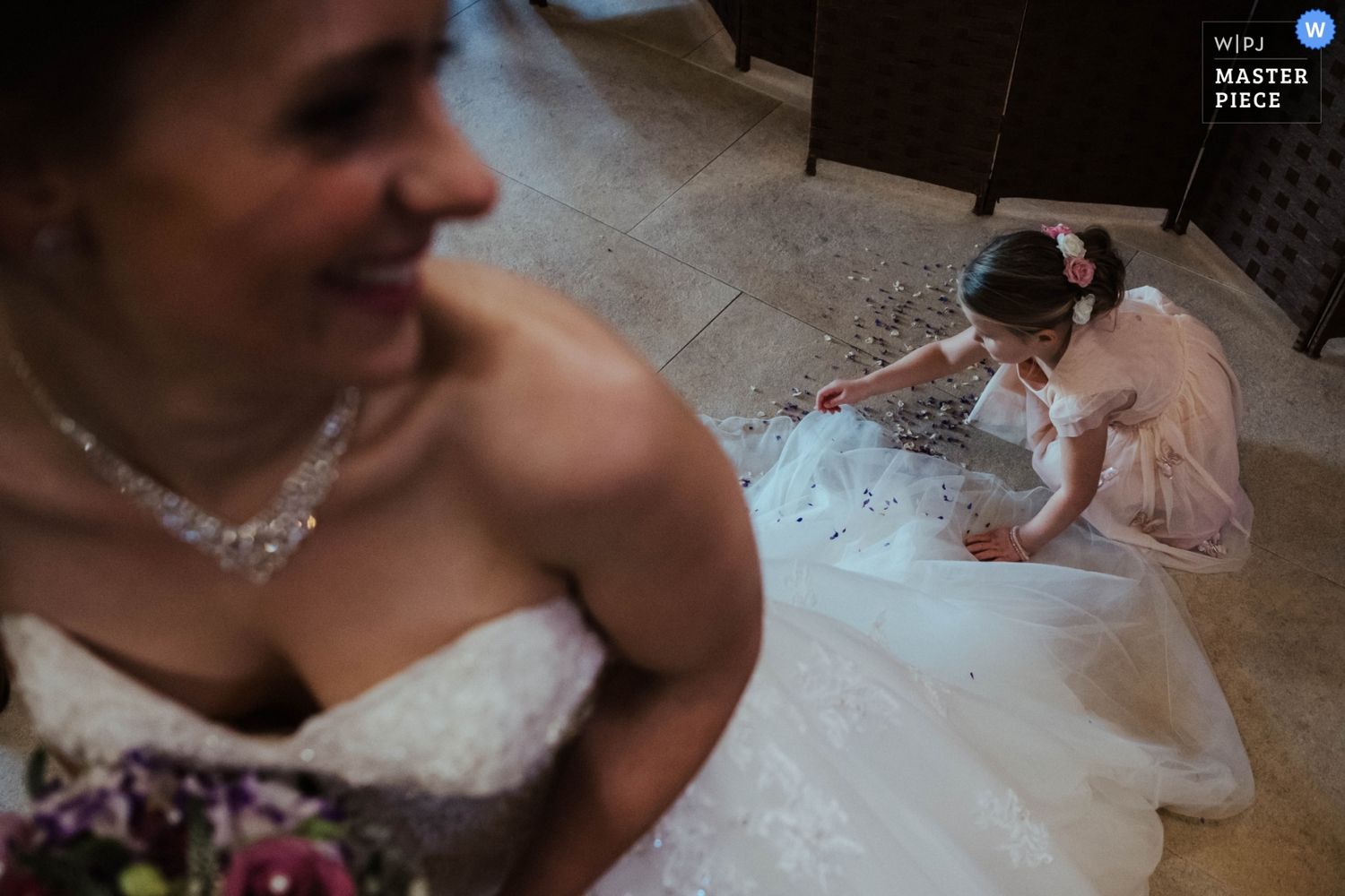 A close-up view of wedding dress details with delicate lace and beading.