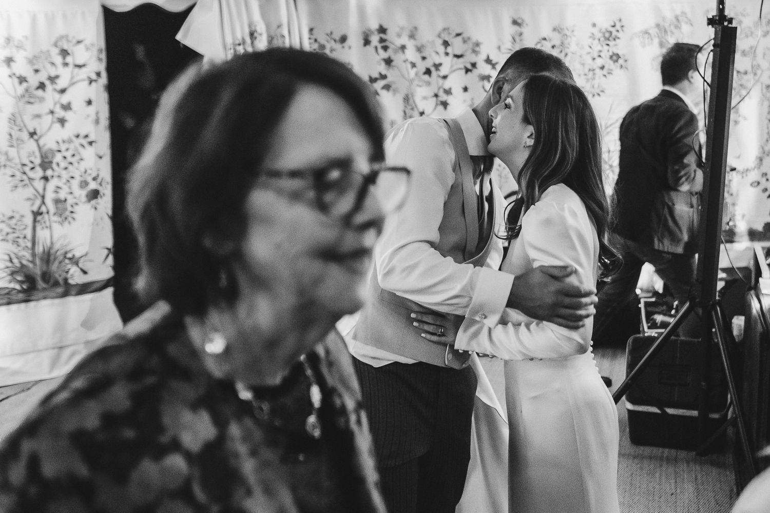 A black and white photo strip showing multiple candid moments at what appears to be a social gathering or party.