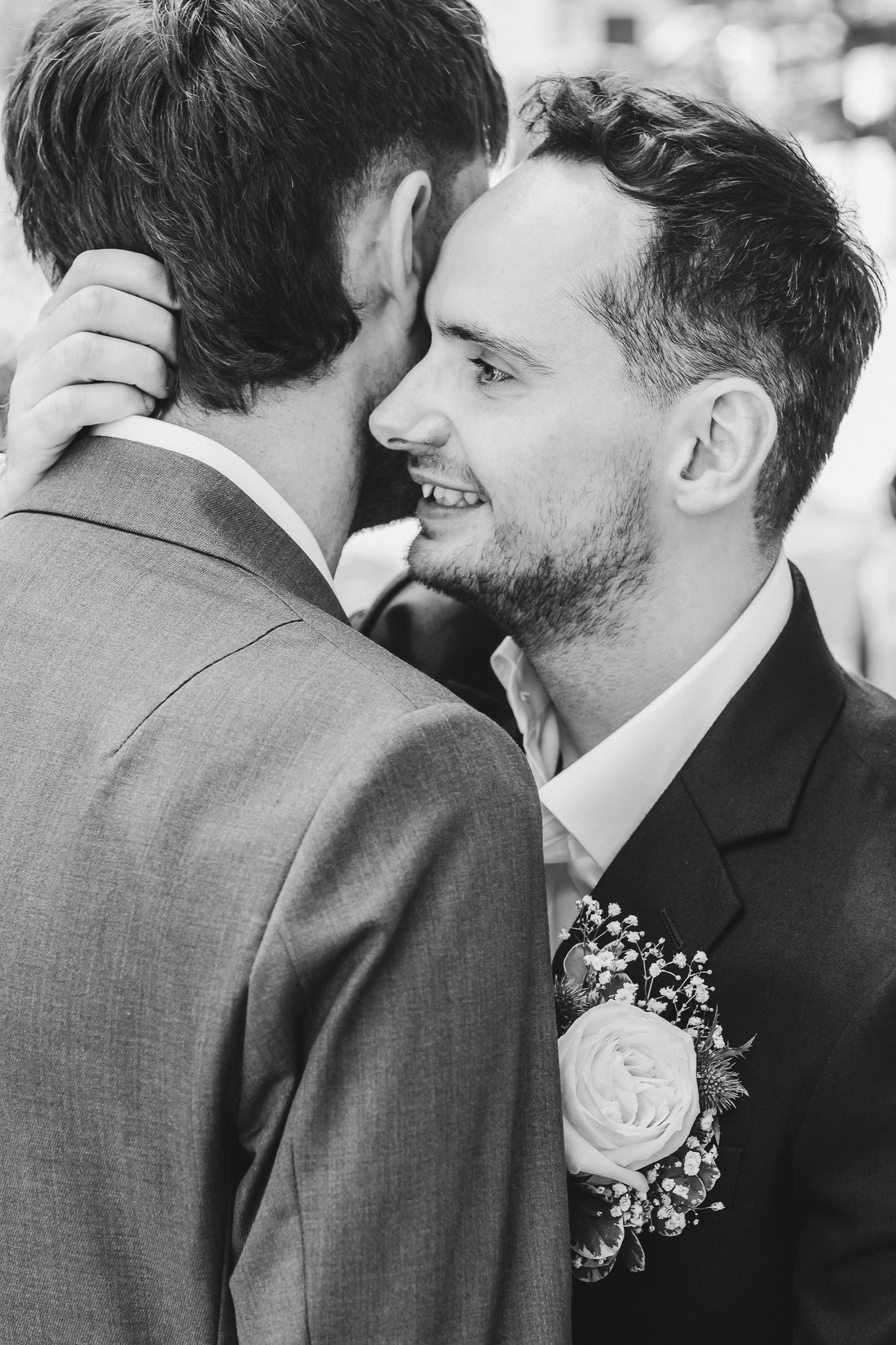 A black and white photograph showing three different cropped views of people in formal wedding attire.