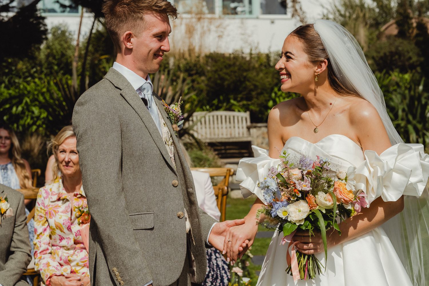 A joyful wedding celebration captured in a series of outdoor photos showing happy moments between the couple and guests.