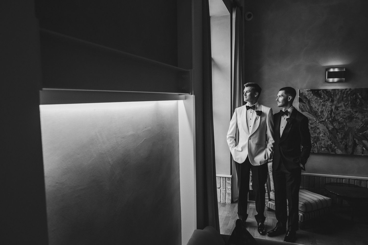 Film noir style black and white image sequence showing figures in dark shadows walking through doorways and corridors.