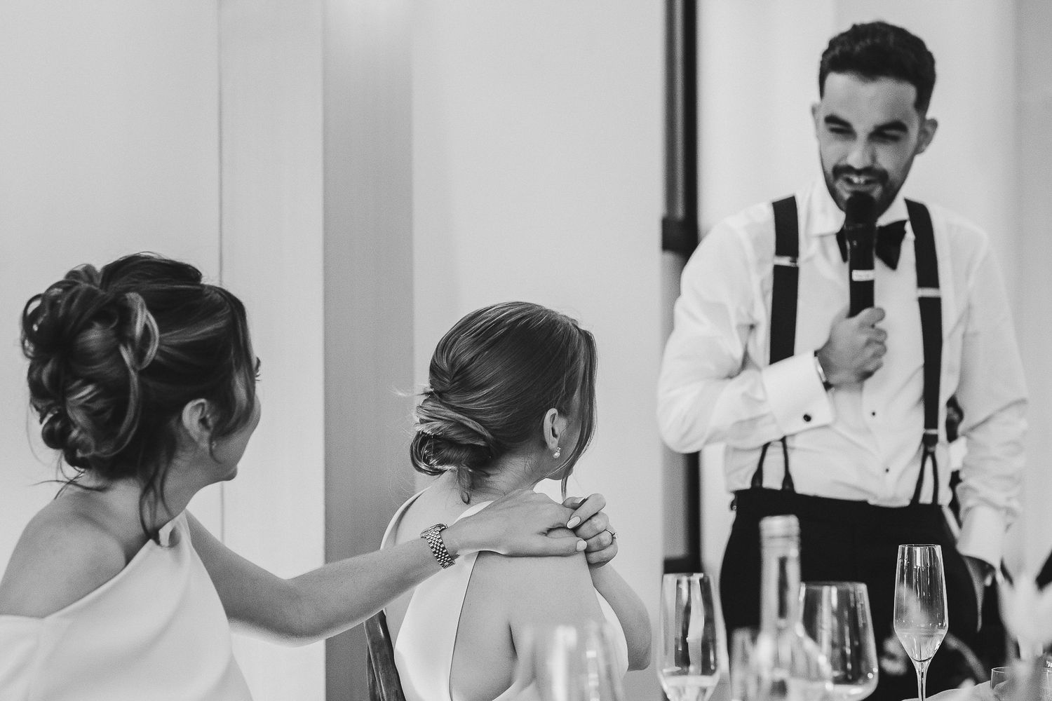 A series of black and white wedding preparation photos showing intimate moments and getting ready details.