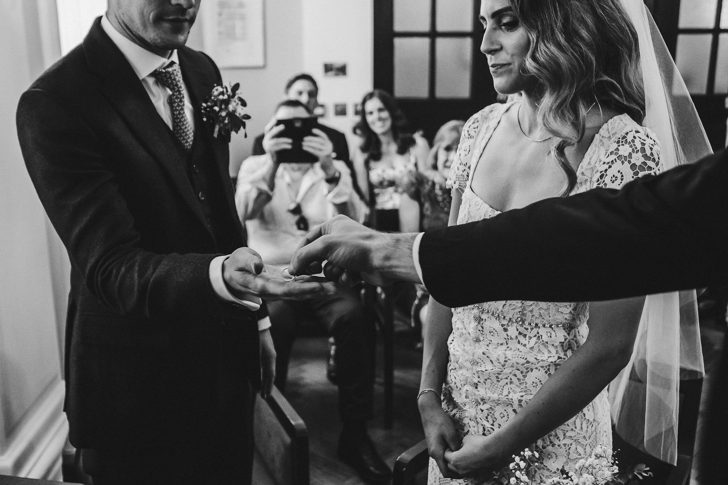 Black and white wedding photos show couples dancing and celebrating during an elegant reception party.