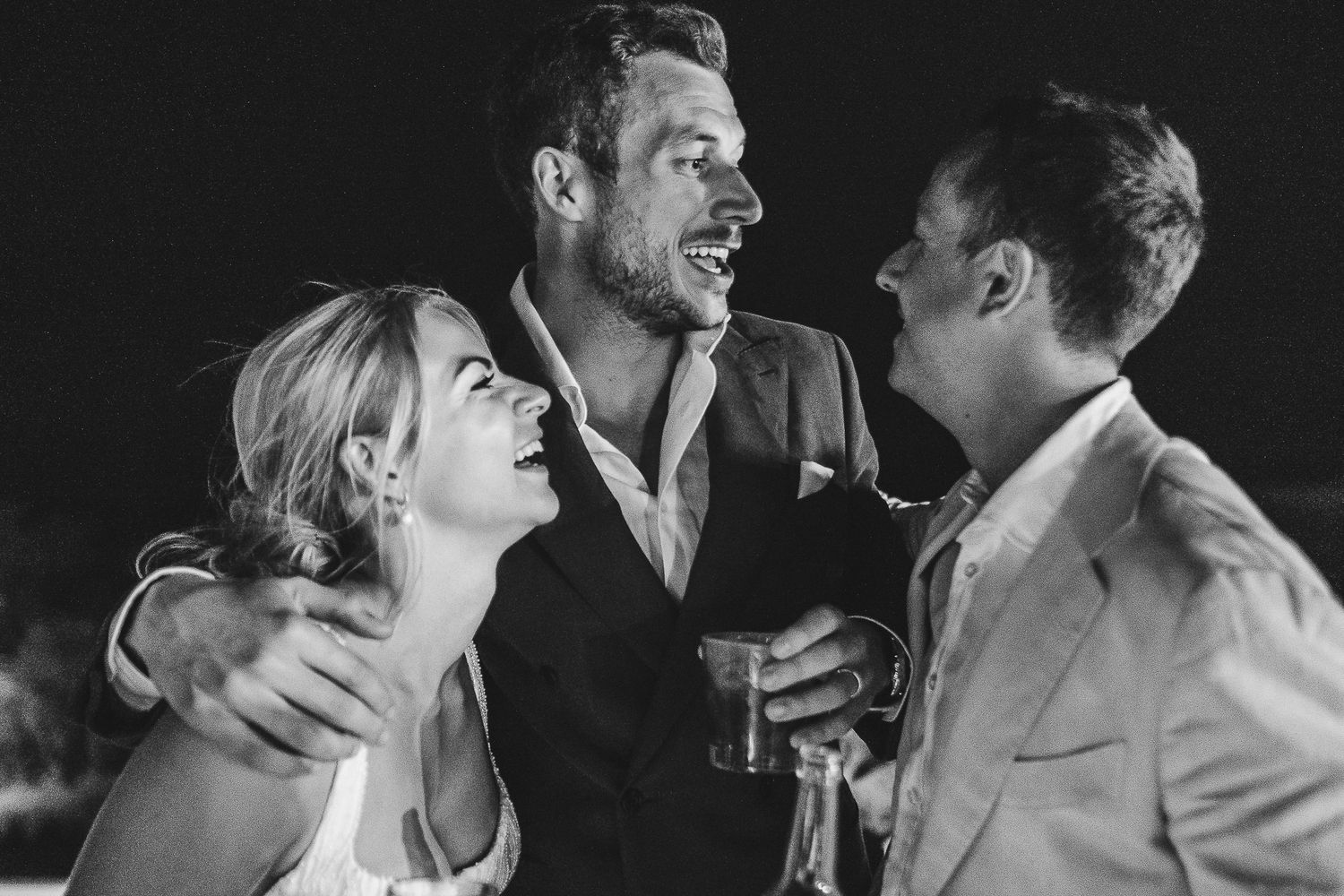 A black and white photo sequence shows a couple sharing an intimate dance and leaning in close together.